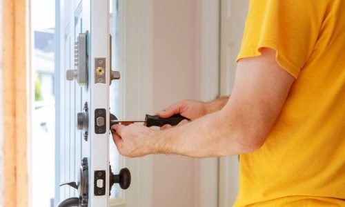 worker-installing-repairing-new-lock